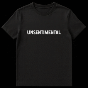 Black t-shirt featuring the word UNSENTIMENTAL in white, distressed, grunge uppercase letters on Black t-shirt