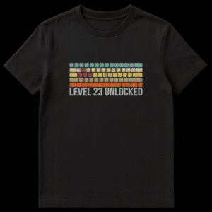 Level 23 Unlocked t-shirt design featuring retro 8-bit colorful bricks and distressed text on a black background on Black t-shirt