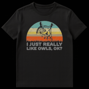 Black t-shirt featuring a distressed retro sunset with a sketch of a Great Horned Owl and text reading I JUST REALLY LIKE OWLS, OK? on Black t-shirt