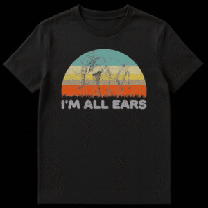 Silhouette of an elephant against a retro 70s sunset with the text I'm All Ears below it on a t-shirt on Black t-shirt