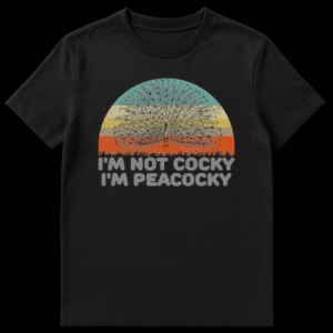 Vintage style t-shirt design featuring a silhouette of a peacock with fanned feathers against a retro striped sunset, with the text I'M NOT COCKY I'M PEACOCKY below in distressed lettering. on Black t-shirt