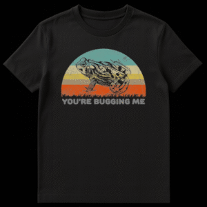 Vintage style illustration of a toad sitting in front of a retro striped sunset with the text You're Bugging Me on Black t-shirt
