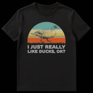 Vintage illustration of a walking mallard duck against a retro striped sunset with text reading I JUST REALLY LIKE DUCKS OK on Black t-shirt