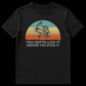 Vintage style graphic t-shirt with a sunset background featuring a tongue licking a postage stamp and the text You Gotta Lick It Before You Stick It on Black t-shirt