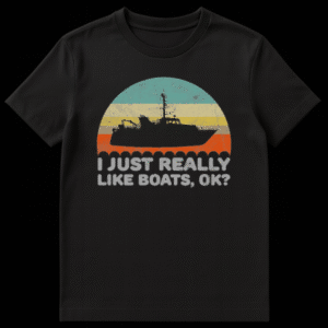 Retro sunset graphic with silhouette of a fishing workboat and text I Just Really Like Boats Ok on Black t-shirt