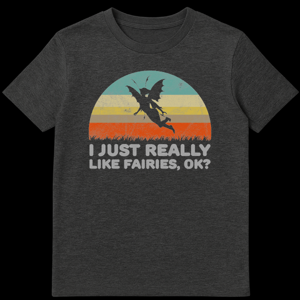 Vintage-style black t-shirt with a retro grunge graphic featuring a fairy silhouette against distressed teal, yellow, and orange stripes, with text 'I JUST REALLY LIKE FAIRIES, OK?' on Dark Heather t-shirt