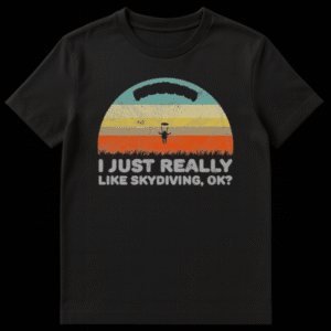 Retro sunset graphic with a black silhouette of a skydiver and text I Just Really Like Skydiving, Ok? on Black t-shirt