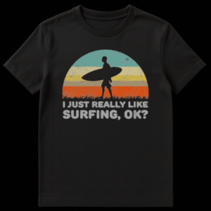 Vintage style t-shirt design with a retro sunset, a black silhouette of a man carrying a surfboard, and funny text reading I JUST REALLY LIKE SURFING, OK? on Black t-shirt