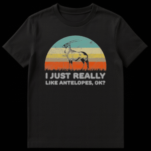Black t-shirt with a vintage-style graphic of an antelope against a striped sunset background and "I JUST REALLY LIKE ANTELOPES, OK?" text. on Black t-shirt