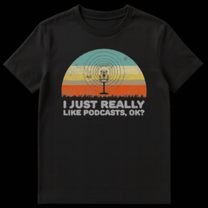 Black t-shirt with retro microphone graphic and text 'I JUST REALLY LIKE PODCASTS, OK?'. Design has a vintage sunset background and grass silhouettes. on Black t-shirt