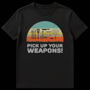 T-shirt design with silhouettes of grilling tools like forks, spatulas, and tongs, with text 'PICK UP YOUR WEAPONS!' and a striped outdoor background. on Black t-shirt