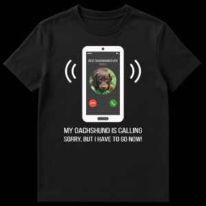 Humorous t-shirt design with a smartphone call screen showing 'BEST DACHSHUND EVER' caller ID and a dachshund puppy profile picture, with text 'MY DACHSHUND IS CALLING SORRY, BUT I HAVE TO GO NOW!' on Black t-shirt