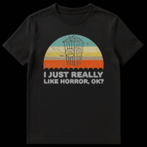 Retro distressed black t-shirt design with a popcorn bucket and "I JUST REALLY LIKE HORROR, OK?" text for horror movie fans. on Black t-shirt