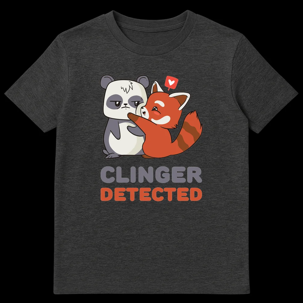 Cartoon t-shirt design with a happy red panda clinging to an unimpressed giant panda. Text above reads 'CLINGER DETECTED'. on Dark Heather t-shirt