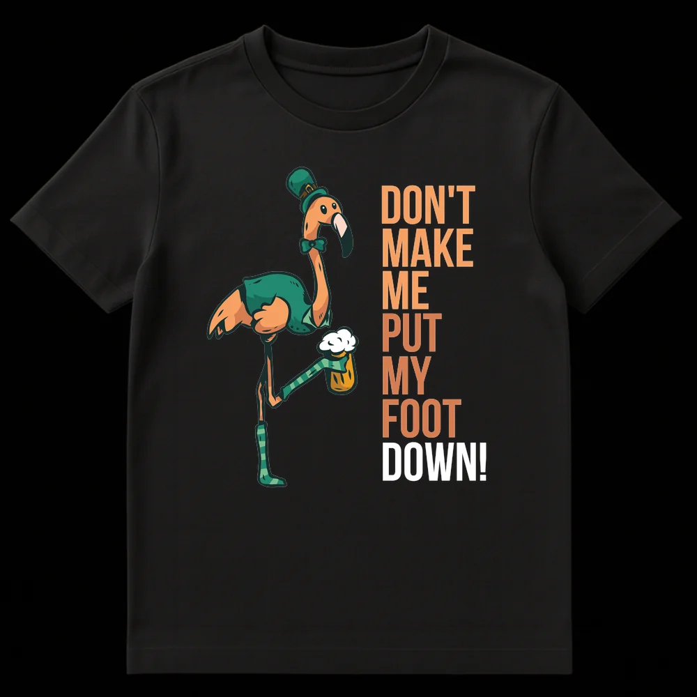 Funny St. Patrick's Day t-shirt with a cartoon flamingo wearing a leprechaun hat, vest, and bow tie, holding a beer. The flamingo is standing on one leg, with the other raised, and the text reads 'DON'T MAKE ME PUT MY FOOT DOWN!' on Black t-shirt
