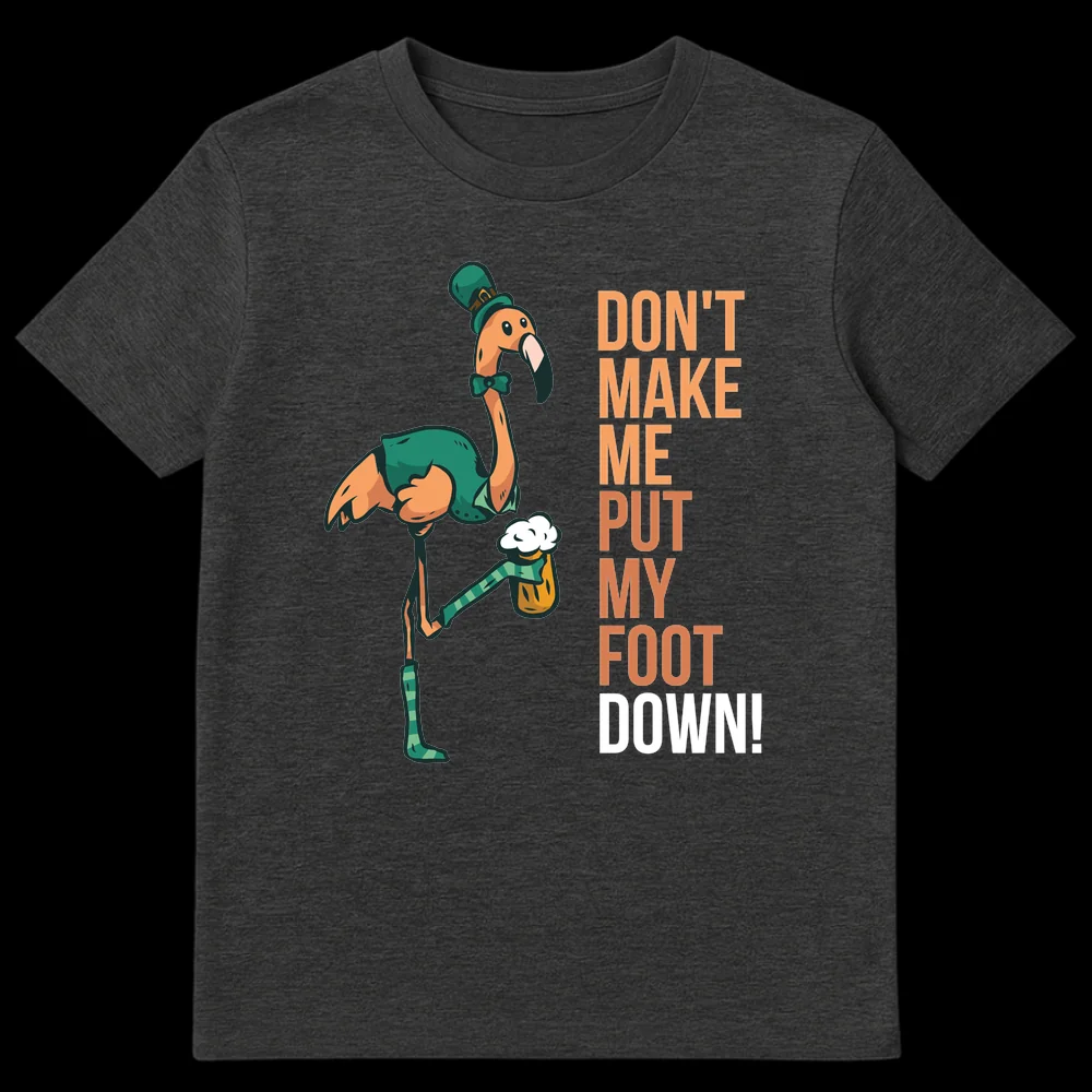 Funny St. Patrick's Day t-shirt with a cartoon flamingo wearing a leprechaun hat, vest, and bow tie, holding a beer. The flamingo is standing on one leg, with the other raised, and the text reads 'DON'T MAKE ME PUT MY FOOT DOWN!' on Dark Heather t-shirt