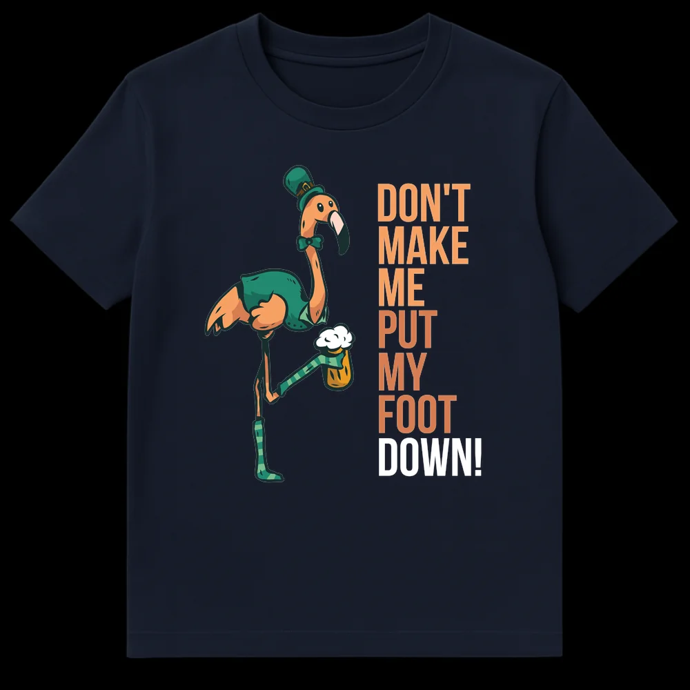 Funny St. Patrick's Day t-shirt with a cartoon flamingo wearing a leprechaun hat, vest, and bow tie, holding a beer. The flamingo is standing on one leg, with the other raised, and the text reads 'DON'T MAKE ME PUT MY FOOT DOWN!' on Navy Blue t-shirt