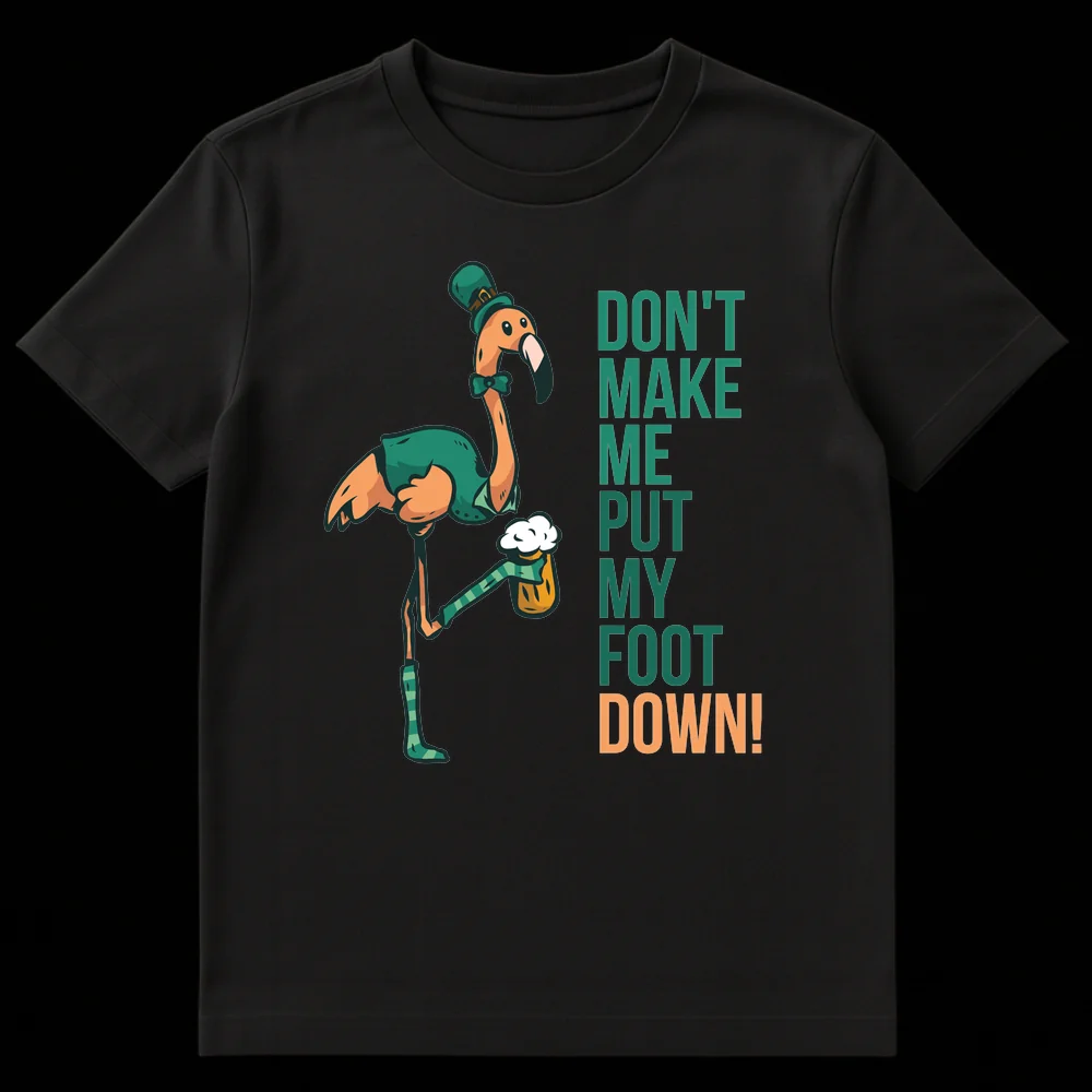 Humorous St. Patrick's Day t-shirt featuring a cartoon flamingo in green attire holding a beer mug with its foot, with the text 'DON'T MAKE ME PUT MY FOOT DOWN!' on Black t-shirt