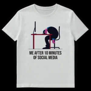 Cartoon design t-shirt showing a person slumped over a desk with the text "ME AFTER 10 MINUTES OF SOCIAL MEDIA" on White t-shirt