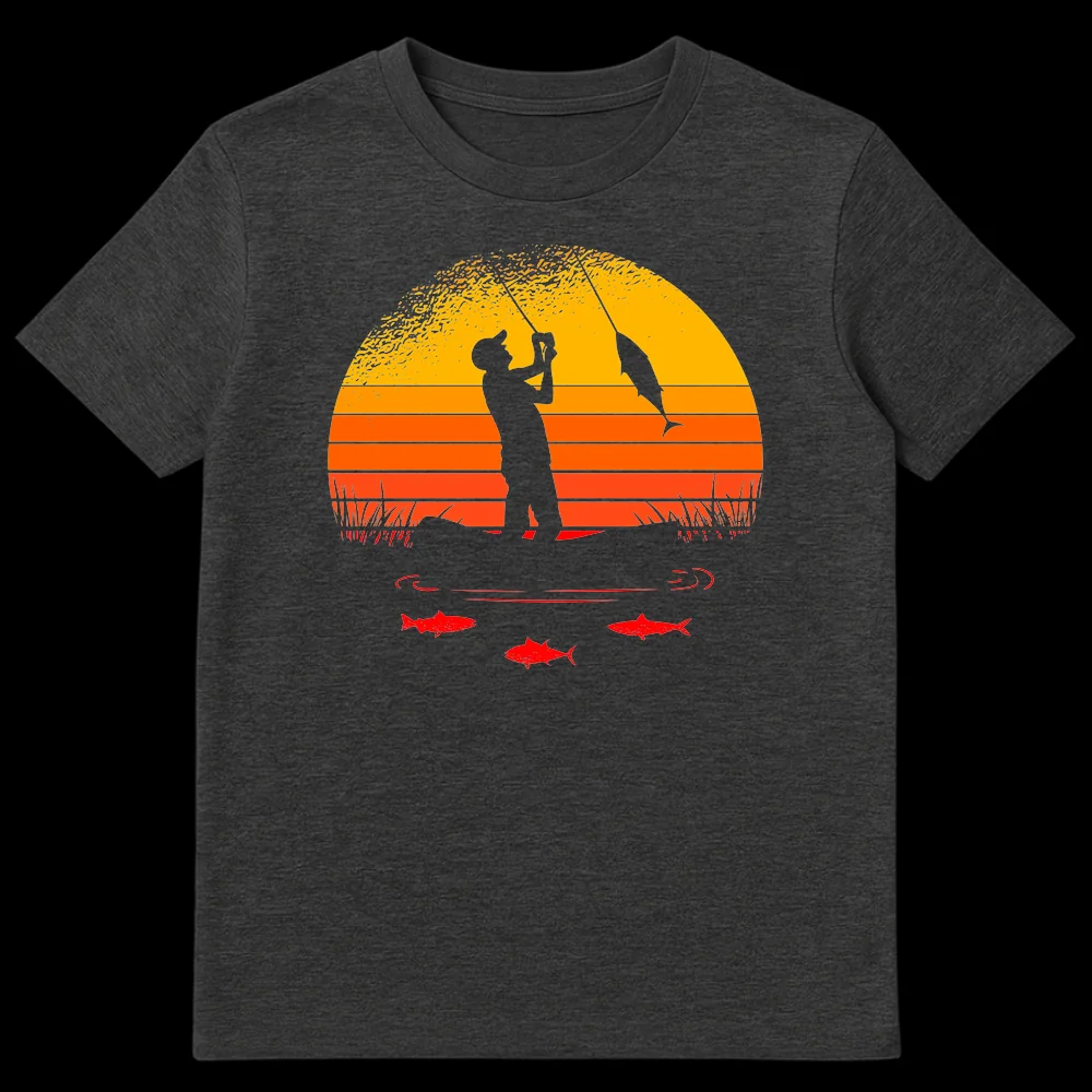 Retro sunset fishing t-shirt featuring a silhouette of a fisherman reeling in a large fish against a striped orange and yellow sunset background with smaller red fish underwater. on Dark Heather t-shirt