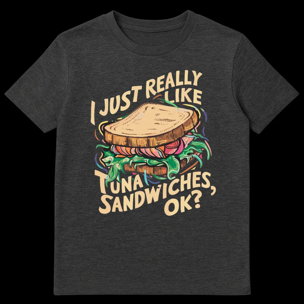 Humorous black t-shirt with a cartoon tuna sandwich and the text 'I JUST REALLY LIKE TUNA SANDWICHES, OK?' in cream color. on Dark Heather t-shirt
