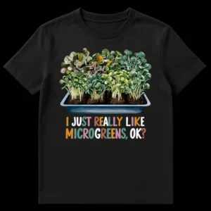 T-shirt with detailed illustration of microgreens in a tray and text 'I JUST REALLY LIKE MICROGREENS, OK?' on Black t-shirt