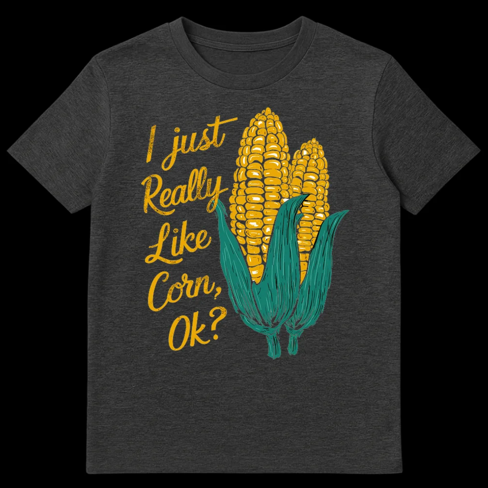 Humorous black t-shirt with retro-style illustration of two ears of corn and text 'I just Really Like Corn, Ok?' in gold and teal. on Dark Heather t-shirt