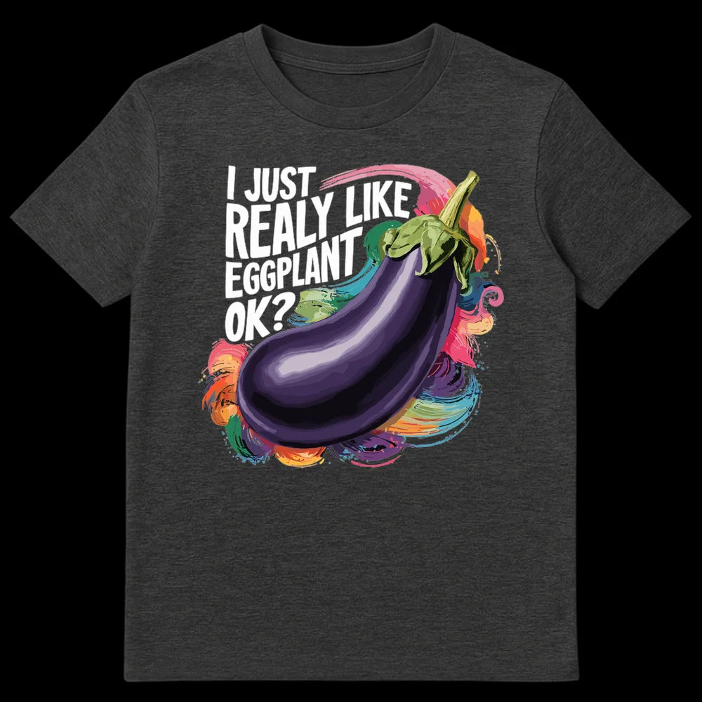Black t-shirt with 'I JUST REALLY LIKE EGGPLANT OK?' text above a vibrant, semi-realistic eggplant illustration surrounded by colorful paint splashes on Dark Heather t-shirt