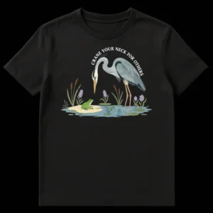 Great Blue Heron t-shirt design with 'CRANE YOUR NECK FOR OTHERS' text, showing a heron observing a frog in a wetland scene on a black background. on Black t-shirt
