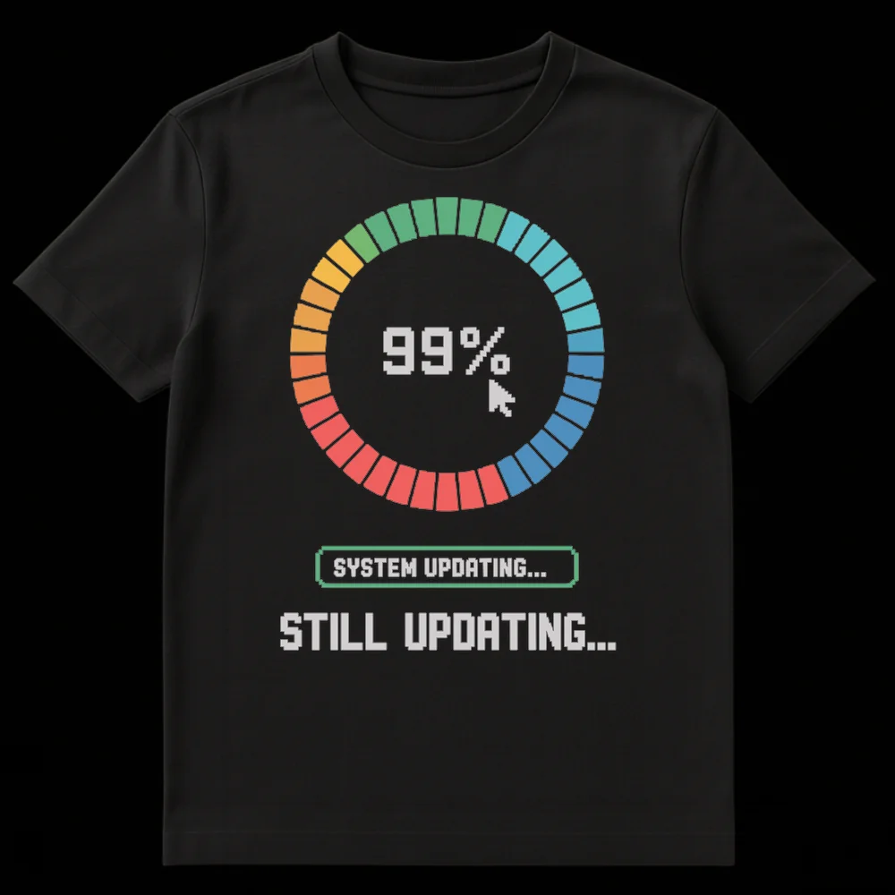 Pixel art t-shirt depicting a 99% loading bar, a mouse pointer, and 'SYSTEM UPDATING... STILL UPDATING...' text on a black background. on Black t-shirt