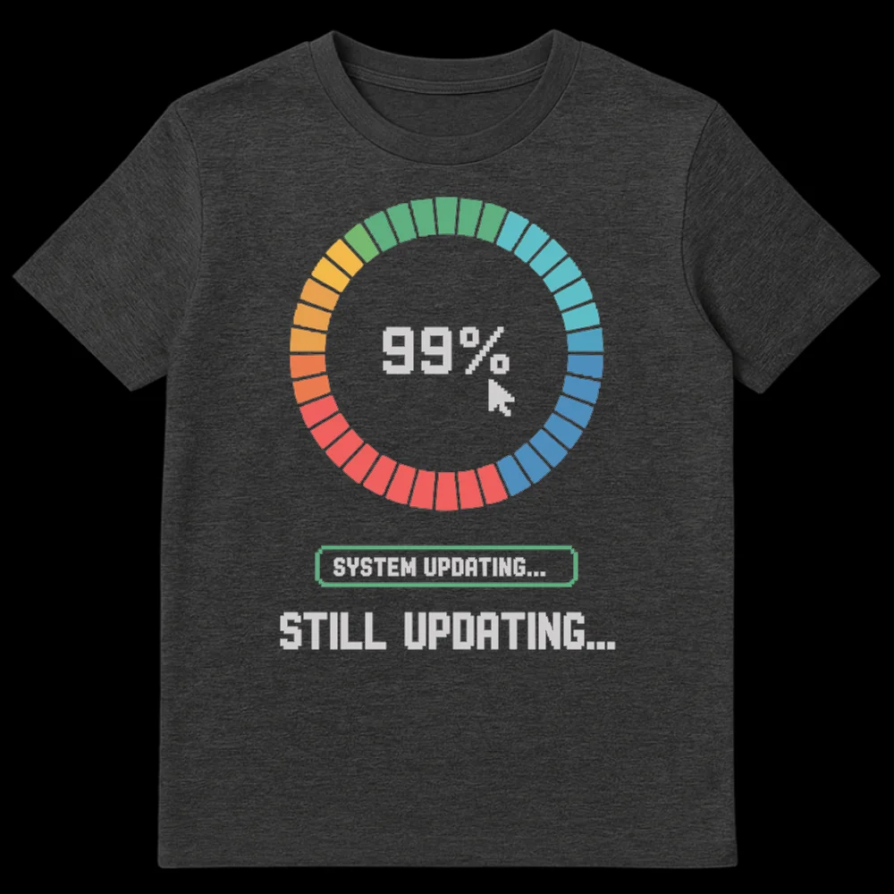 Pixel art t-shirt depicting a 99% loading bar, a mouse pointer, and 'SYSTEM UPDATING... STILL UPDATING...' text on a black background. on Dark Heather t-shirt